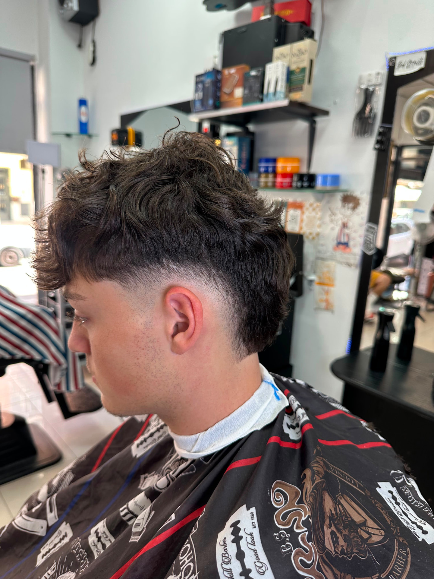 Mullet rizado con drop fade